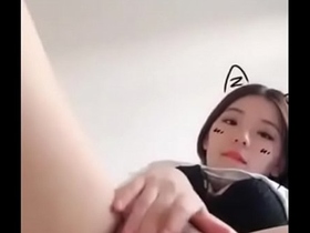 pretty chinese girl masturbates while live